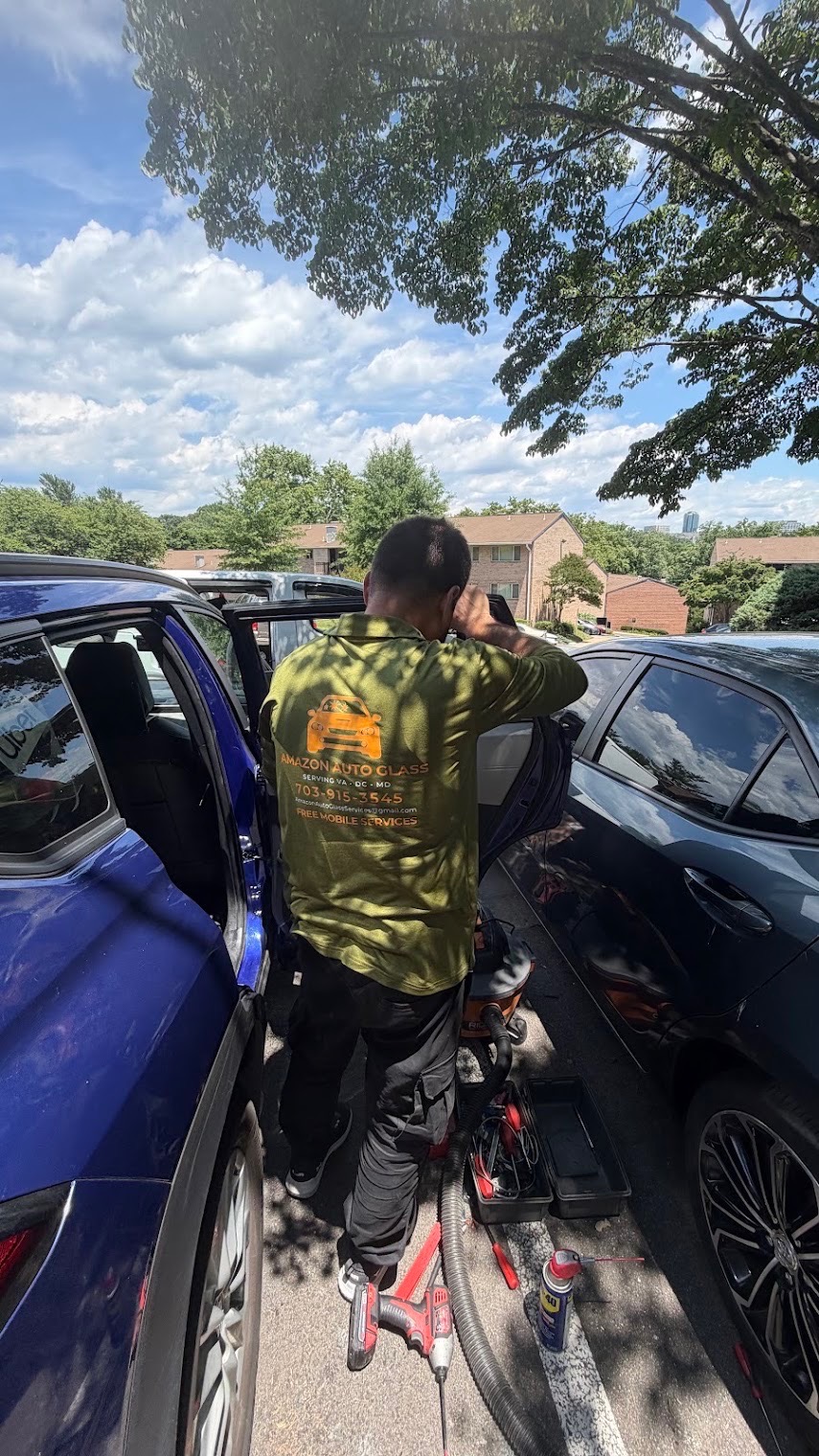 Door glass replacement in an apartment parking lot
